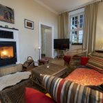 Ferienwohnung Ostwind – Wohnzimmer Kamin